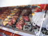 Sausage, chicken drumsticks, skirt steak and sirloin cap (picanha)
