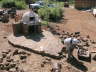 Mason setting path in front of oven and bbq